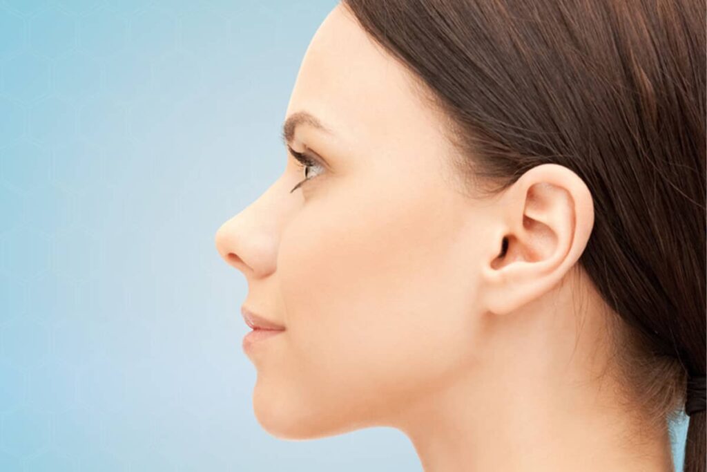 Clear side profile of a woman with a straight nasal bridge and a refined, slightly upturned tip, showcasing the ideal aesthetic outcome of a tip-focused rhinoplasty.